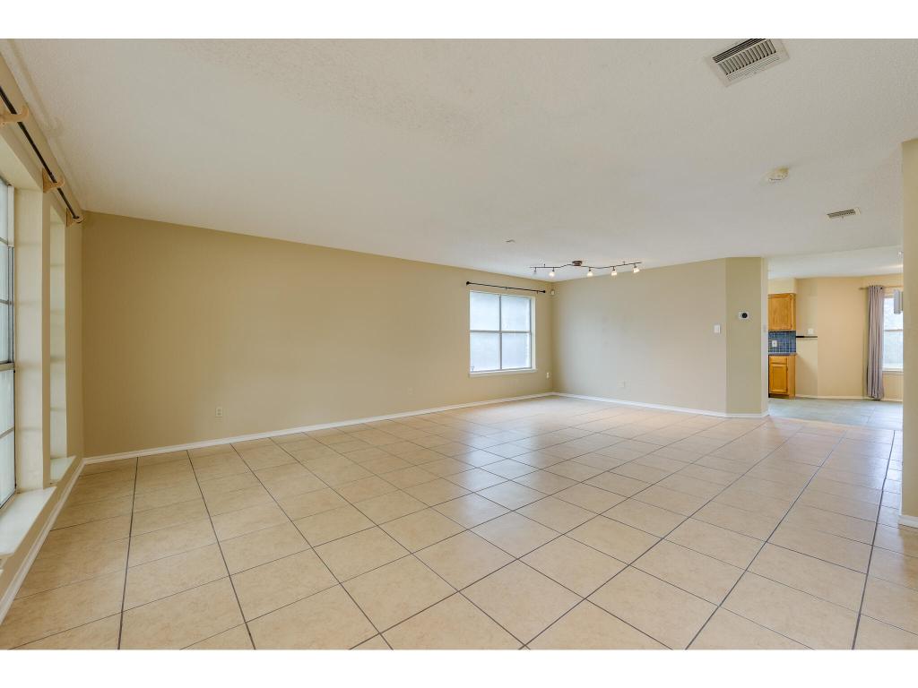 3912 Lemos Drive Austin, TX 78728 - Photo 3 of 40 a view of an empty room and window