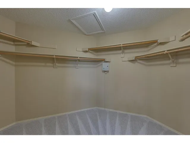 a view of a room with racks on the wall