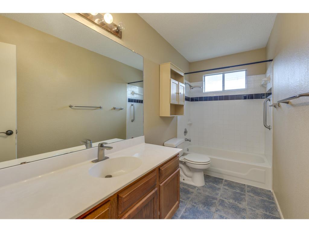 3912 Lemos Drive Austin, TX 78728 - Photo 33 of 40 a bathroom with a sink a toilet and shower