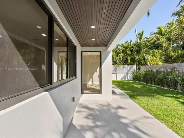 a bathroom with a double vanity sink and mirror