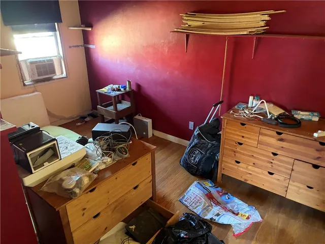 a bed room with a bed and a tv