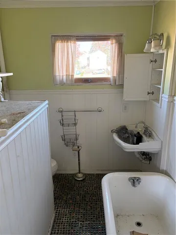 a bathroom with a bathtub and sink