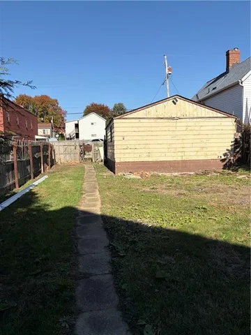 a view of house with yard