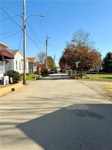 a view of a swimming pool with a house