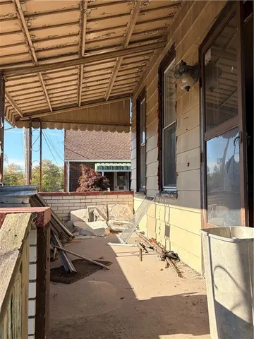 a building with glass top table and chairs