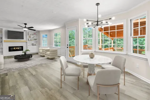 a view of a livingroom with furniture window and wooden floor