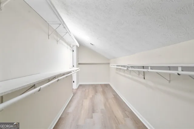 a view of a room with racks on the wall