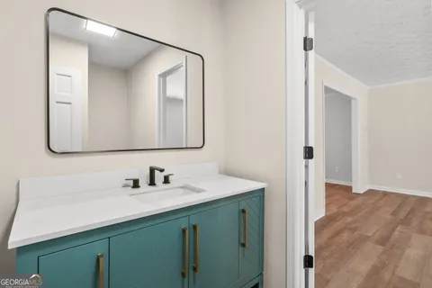 a bathroom with a sink and a mirror