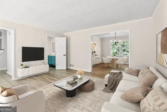 a living room with furniture and a flat screen tv