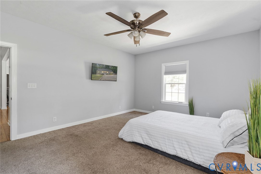 1755 Dispatch Road Quinton, VA 23141 - Photo 36 of 86 a bedroom with a bed and window