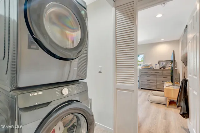 a bedroom with a bed and a ceiling fan