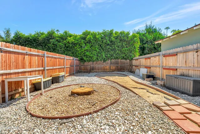 a view of a backyard with sitting area and furniture