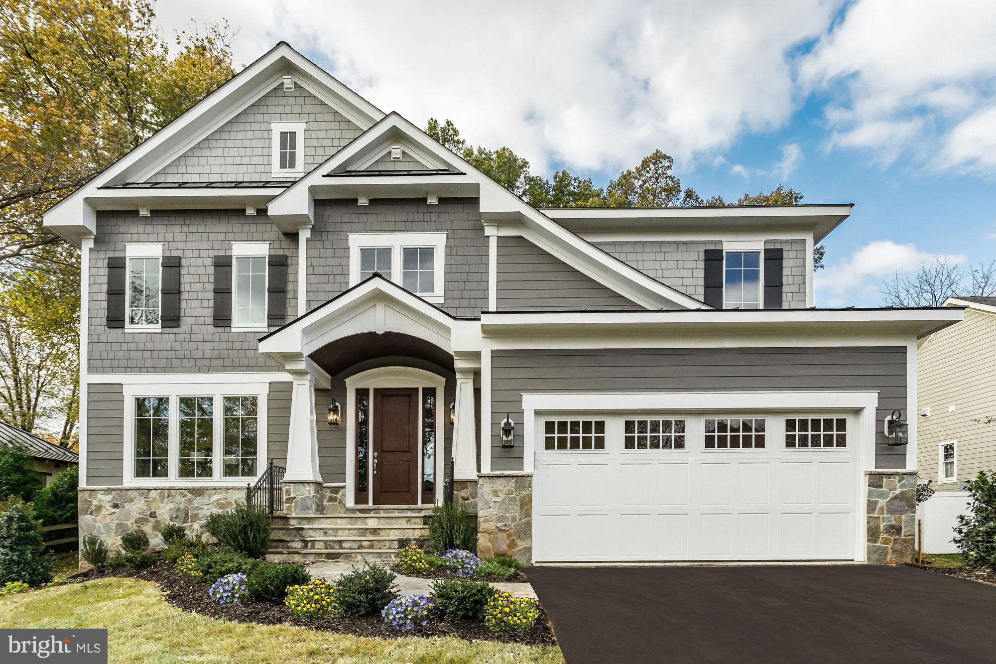 4952 Brook Forest Drive Fairfax, VA 22030 - Photo 1 of 35 a front view of a house with a garden