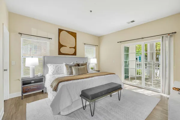 a bedroom with a bed and glass window