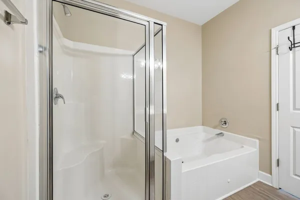 a bathroom with a bathtub and shower