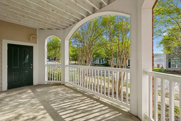 a view of a porch with wooden floor and outdoor space