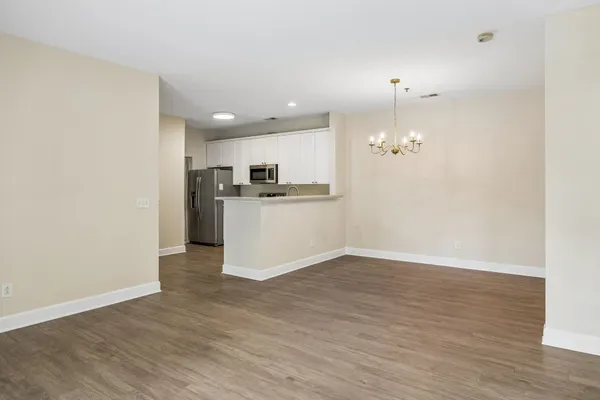 a view of a kitchen with a sink and microwave