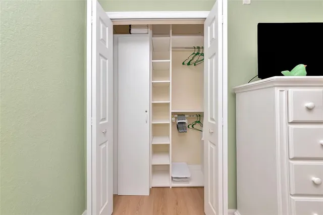 a front view of a house with a yard and a garden