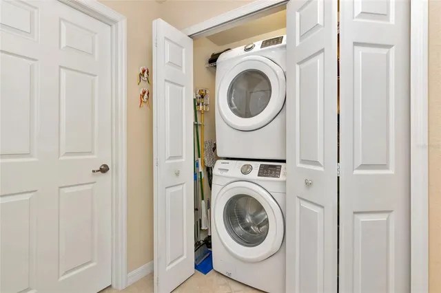 an aerial view of a residential houses with outdoor space swimming pool and lake view