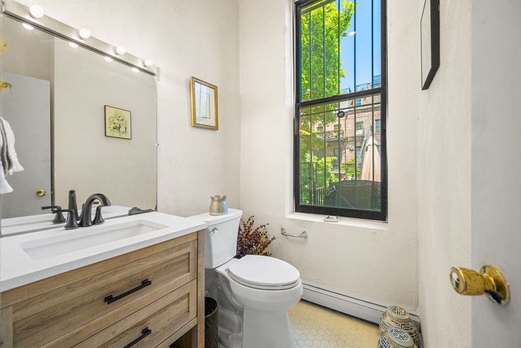 50 East Springfield Street, Unit 1 Boston, MA 02118 - Photo 11 of 23 a bathroom with a toilet a sink and a window