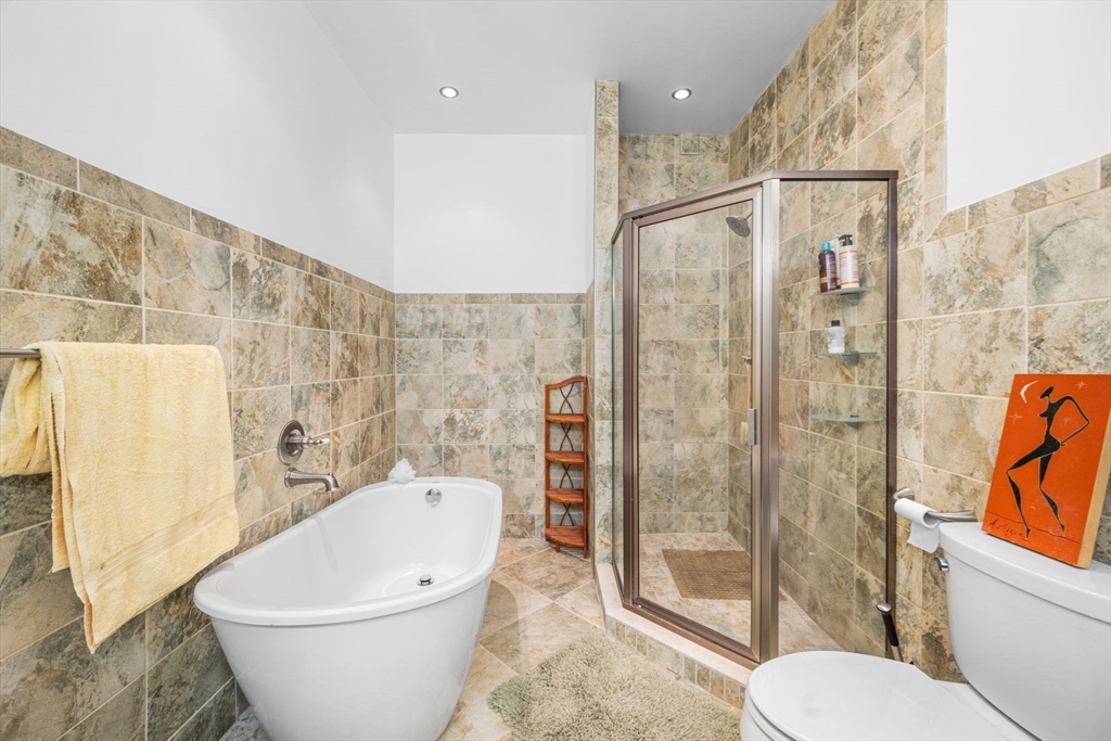 50 East Springfield Street, Unit 1 Boston, MA 02118 - Photo 15 of 23 a bathroom with a white toilet and shower