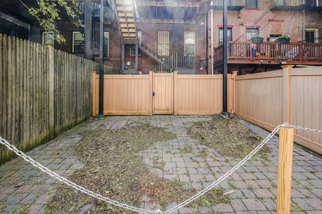 50 East Springfield Street, Unit 1 Boston, MA 02118 - Photo 20 of 23 a view of a house with a wooden fence