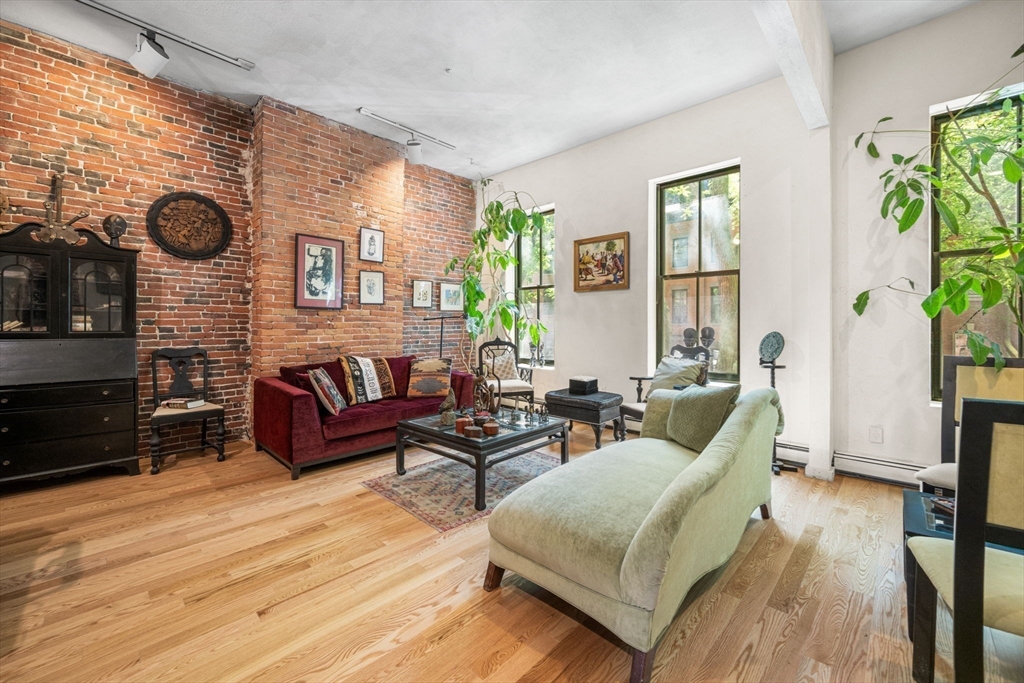 50 East Springfield Street, Unit 1 Boston, MA 02118 - Photo 7 of 23 a living room with furniture and a large window