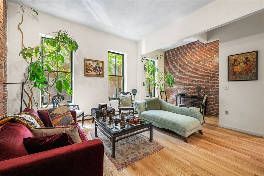 50 East Springfield Street, Unit 1 Boston, MA 02118 - Photo 8 of 23 a living room with furniture and a wooden floor