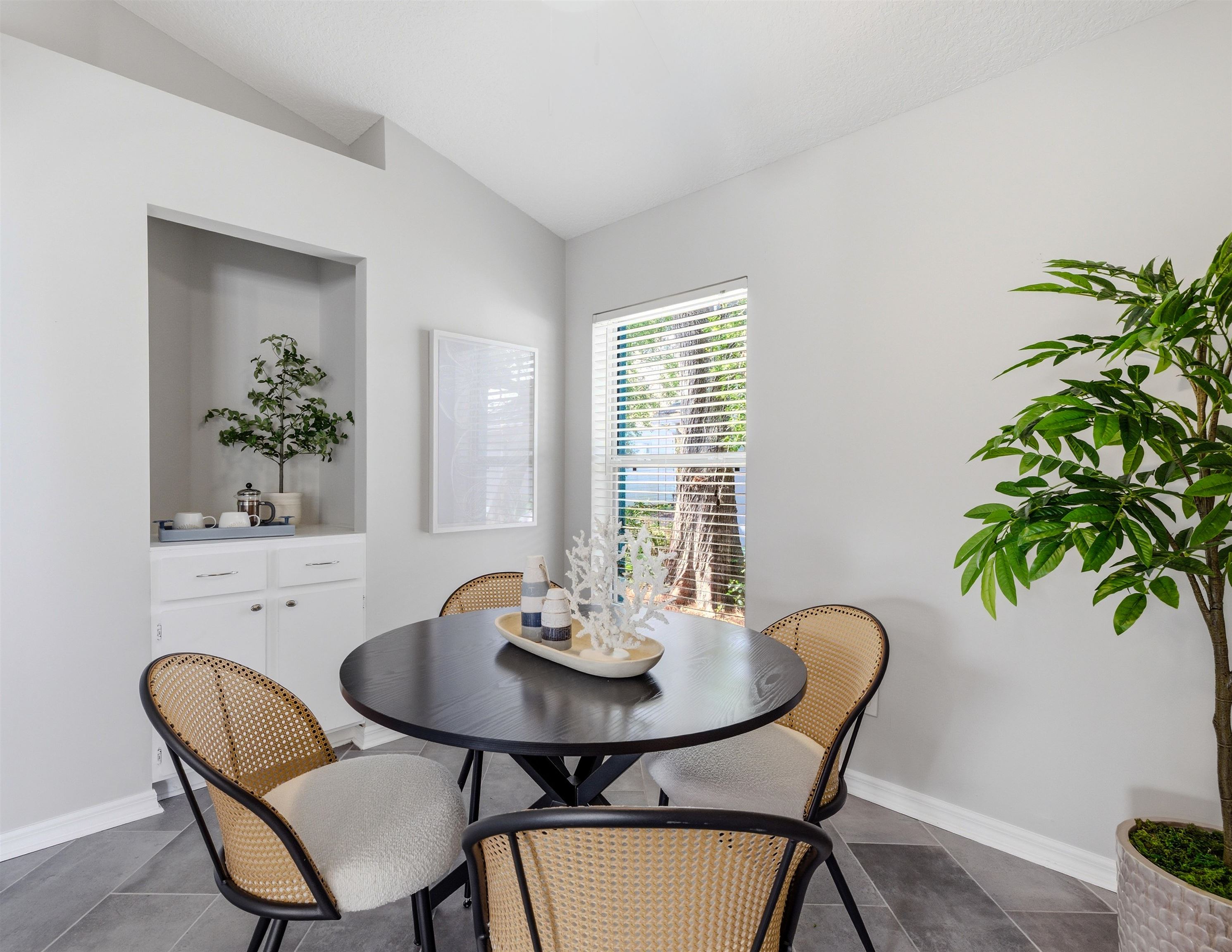 207 11th Street St. Augustine, FL 32080 - Photo 18 of 28 a view of a dining room with furniture and window