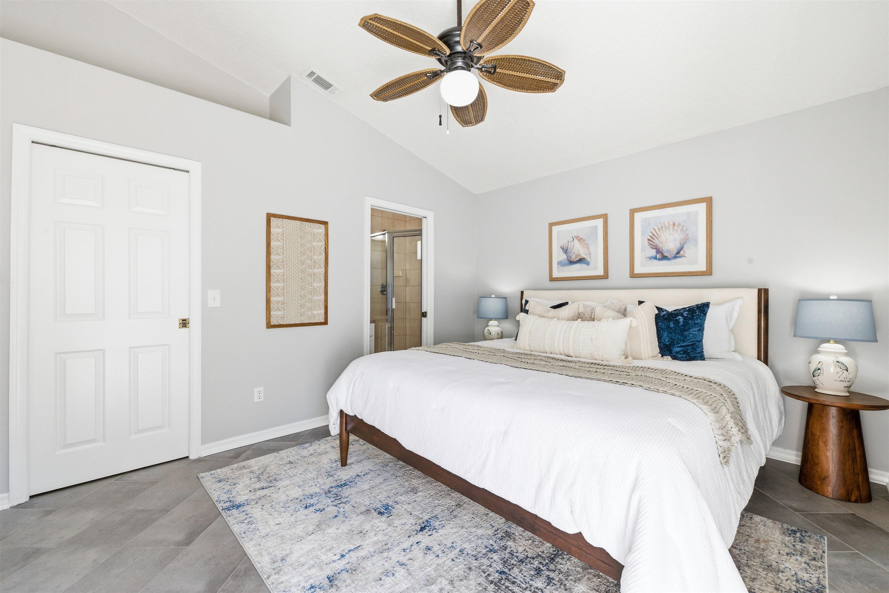 207 11th Street St. Augustine, FL 32080 - Photo 20 of 28 a bedroom with a bed and a painting on the wall