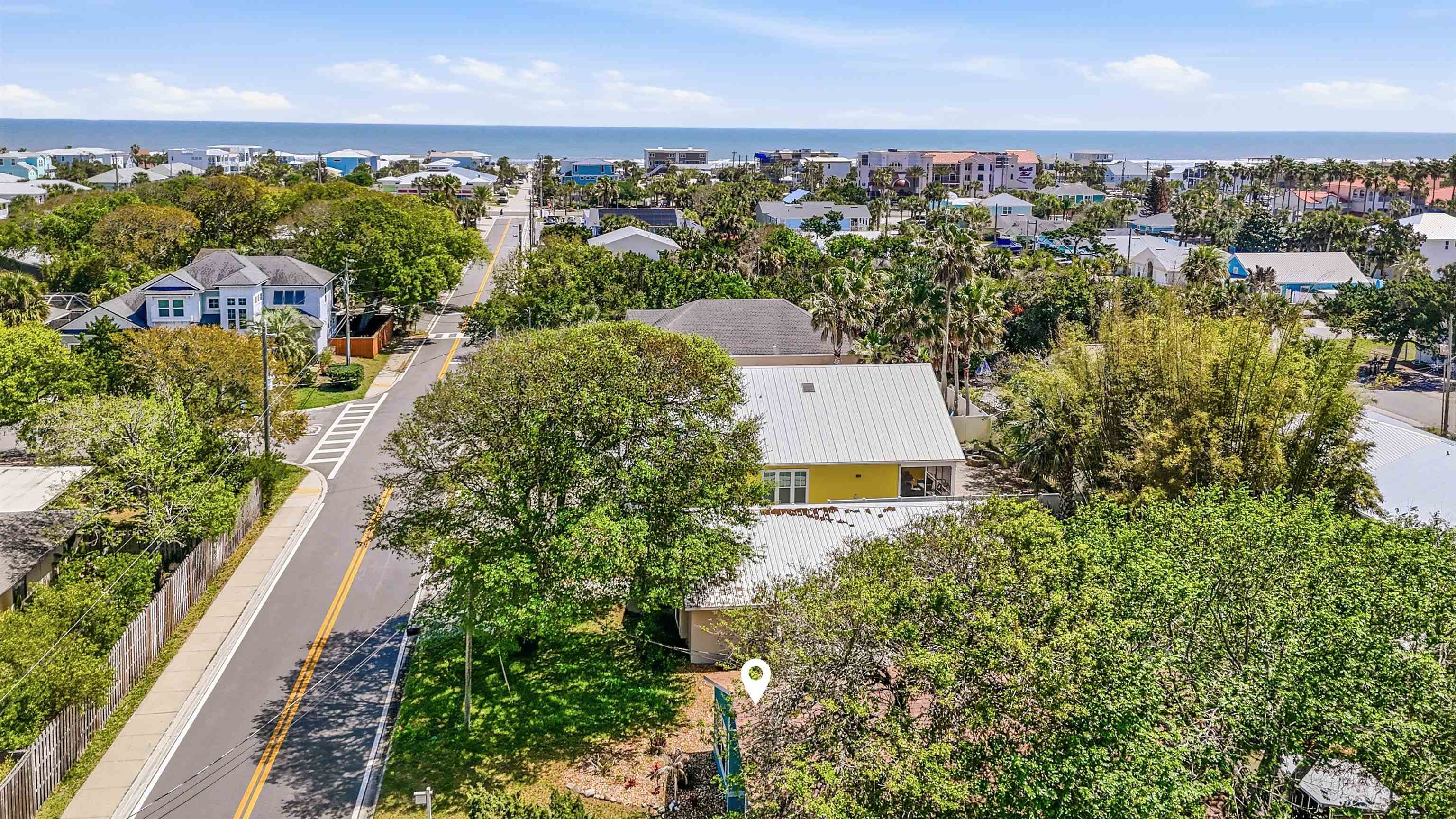 207 11th Street St. Augustine, FL 32080 - Photo 2 of 28 an aerial view of a city with lots of residential buildings ocean and mountain view in back