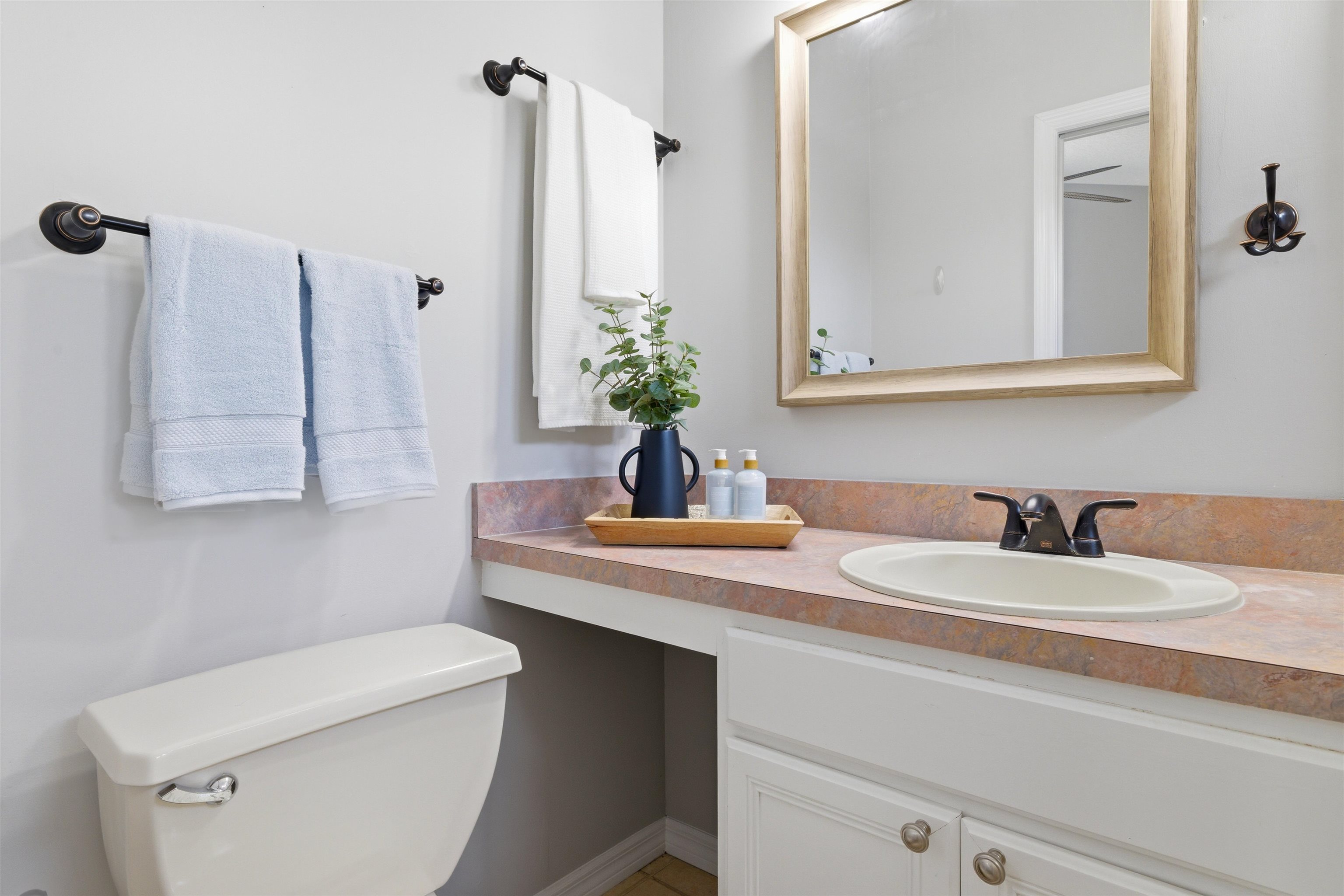 207 11th Street St. Augustine, FL 32080 - Photo 21 of 28 a bathroom with a sink and a toilet