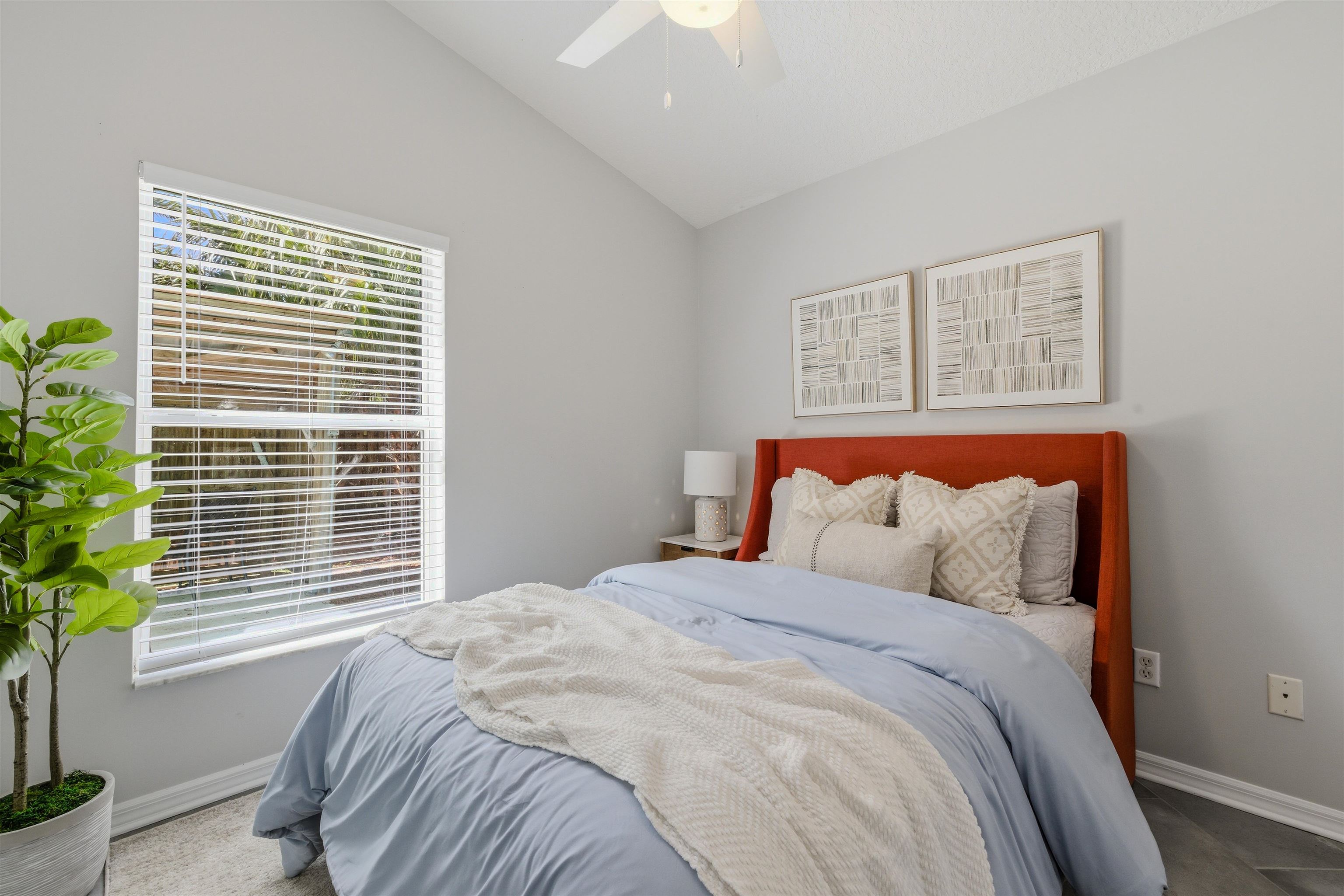 207 11th Street St. Augustine, FL 32080 - Photo 22 of 28 a bedroom with a bed and a window