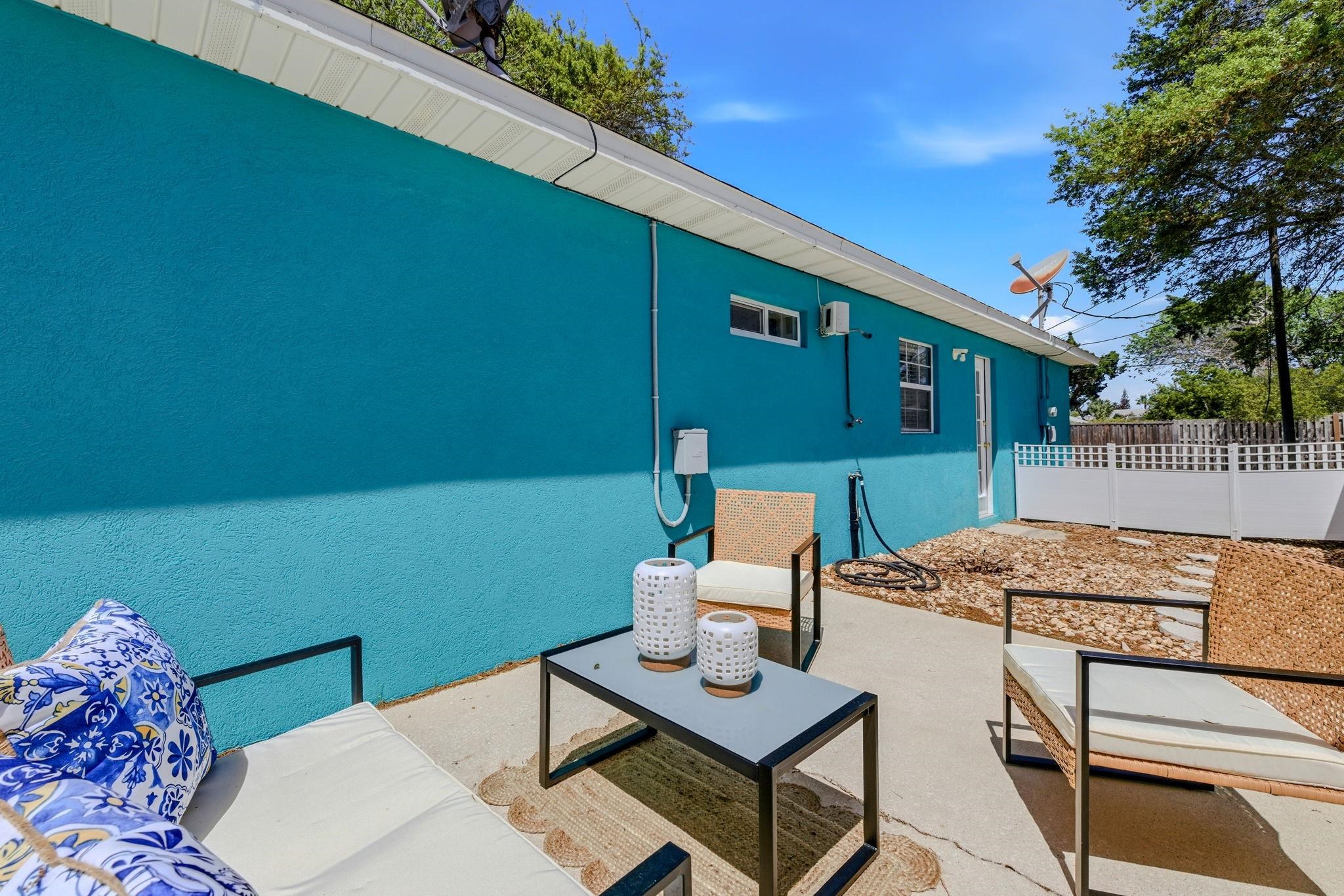 207 11th Street St. Augustine, FL 32080 - Photo 24 of 28 a view of a patio with table and chairs and couches