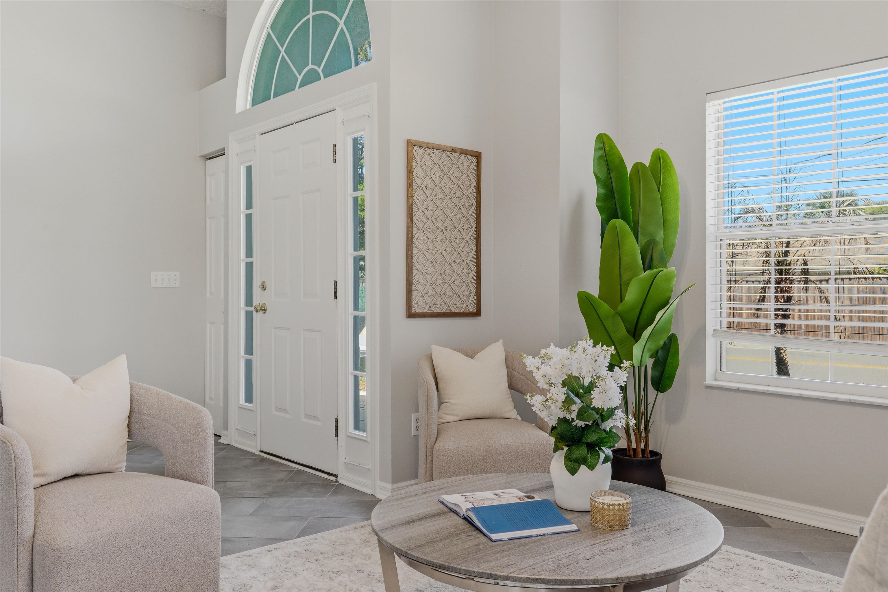 207 11th Street St. Augustine, FL 32080 - Photo 4 of 28 a living room with furniture potted plant and a window