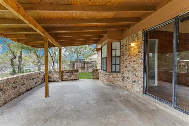 a view of a room with wooden walls