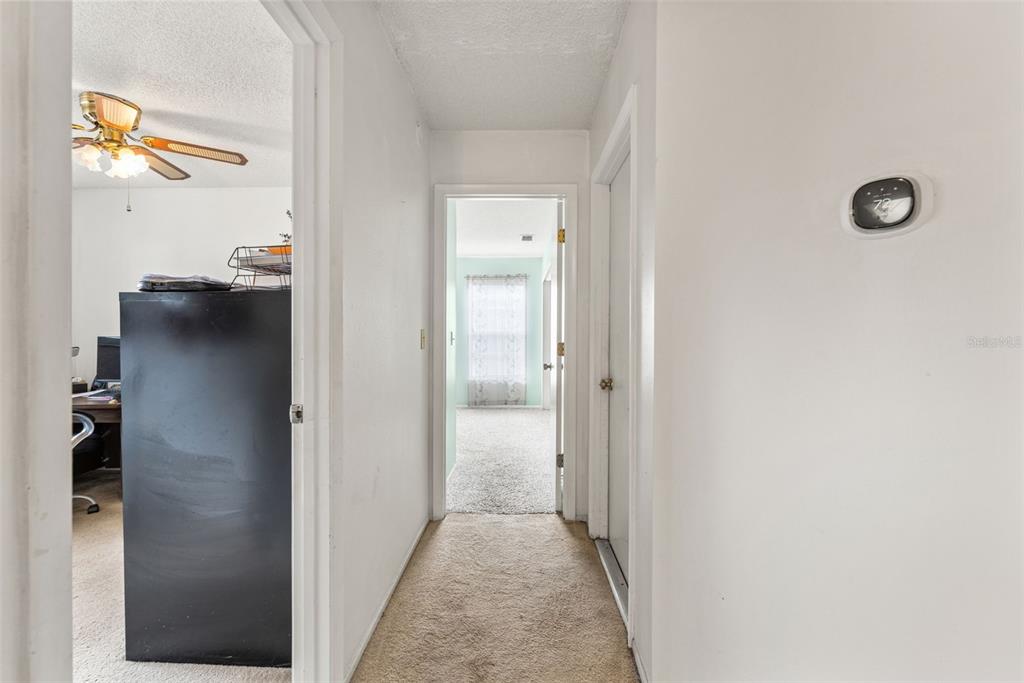 5078 Kenmore Street Spring Hill, FL 34608 - Photo 19 of 31 a view of a hallway with closet and a window