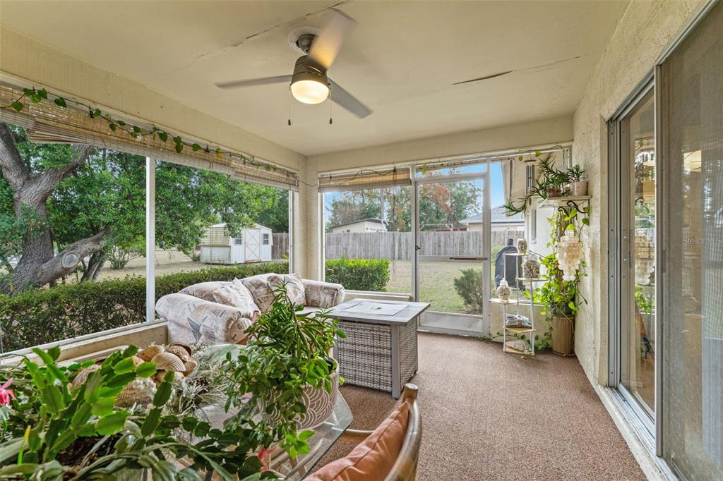 5078 Kenmore Street Spring Hill, FL 34608 - Photo 25 of 31 a balcony with furniture and garden view