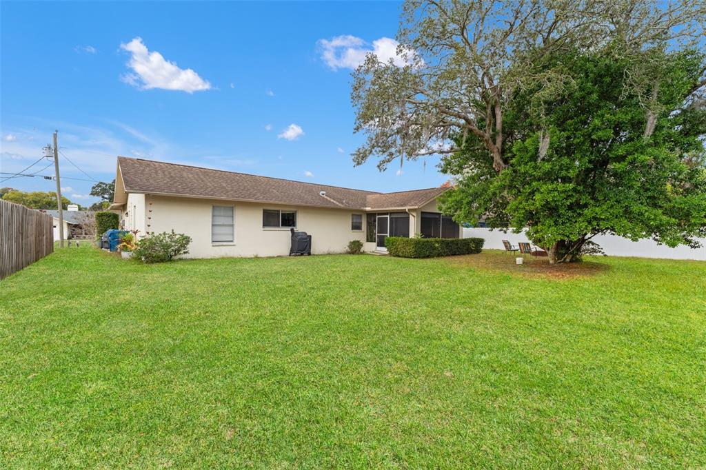 5078 Kenmore Street Spring Hill, FL 34608 - Photo 28 of 31 a front view of a house with a yard