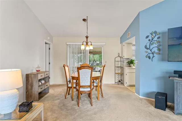 a kitchen with a white cabinets and white appliances
