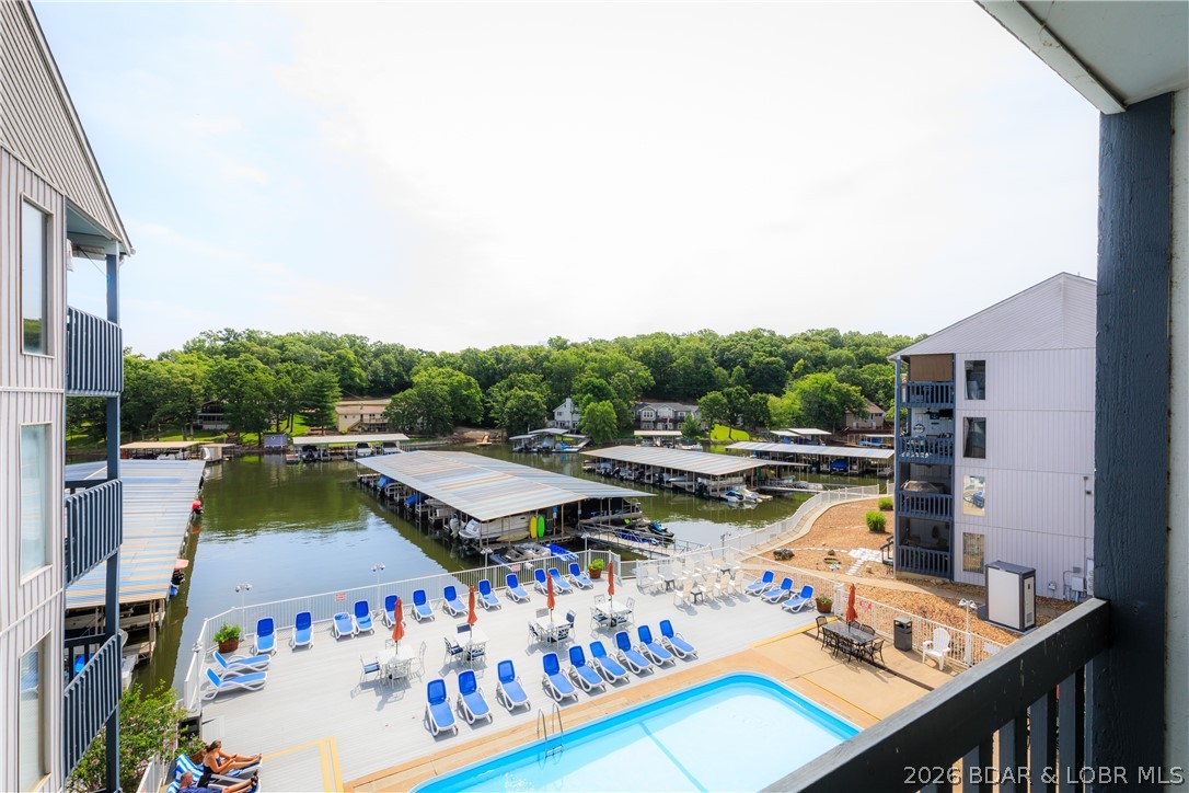 1442 Nichols Road, Unit D301 Osage Beach, MO 65065 - Photo 20 of 42 Great view of the community pool from your covered