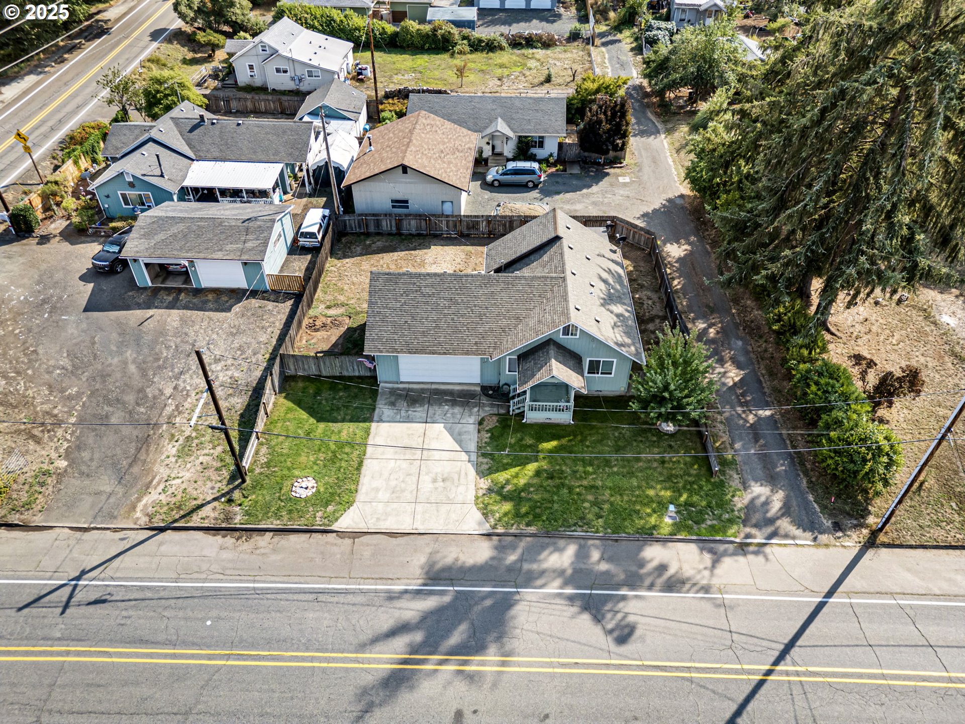 405 Lane Avenue Drain, OR 97435 - Photo 11 of 47 an aerial view of a house with garden space and street view