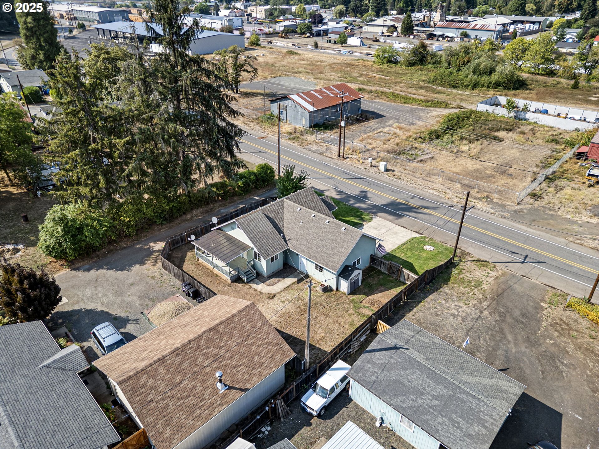 405 Lane Avenue Drain, OR 97435 - Photo 13 of 47 an aerial view of a house with garden space and street view