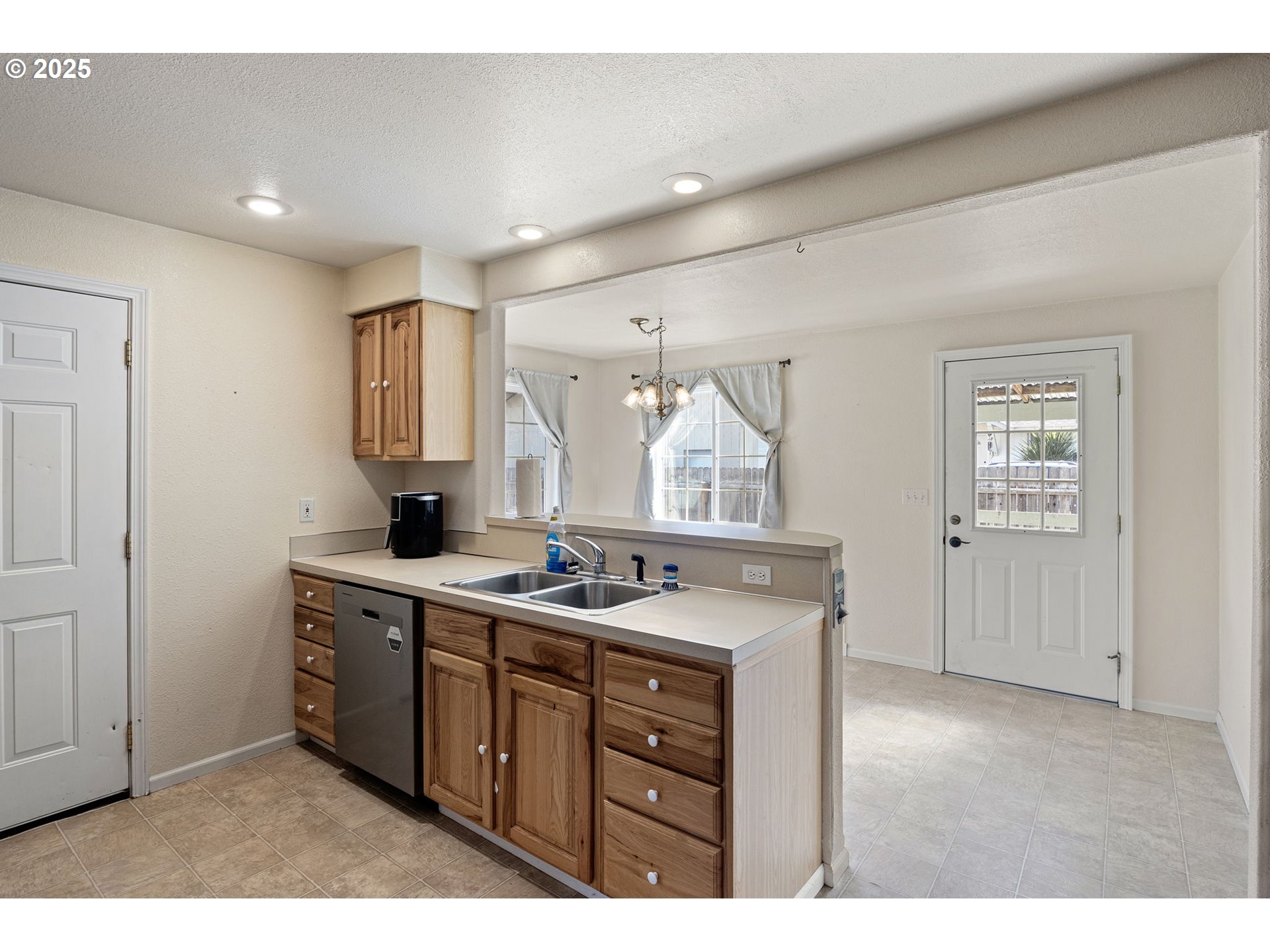 405 Lane Avenue Drain, OR 97435 - Photo 20 of 47 a kitchen with a sink stove and cabinets