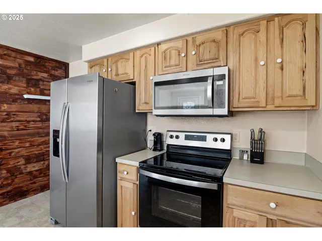 a kitchen with a sink cabinets and window