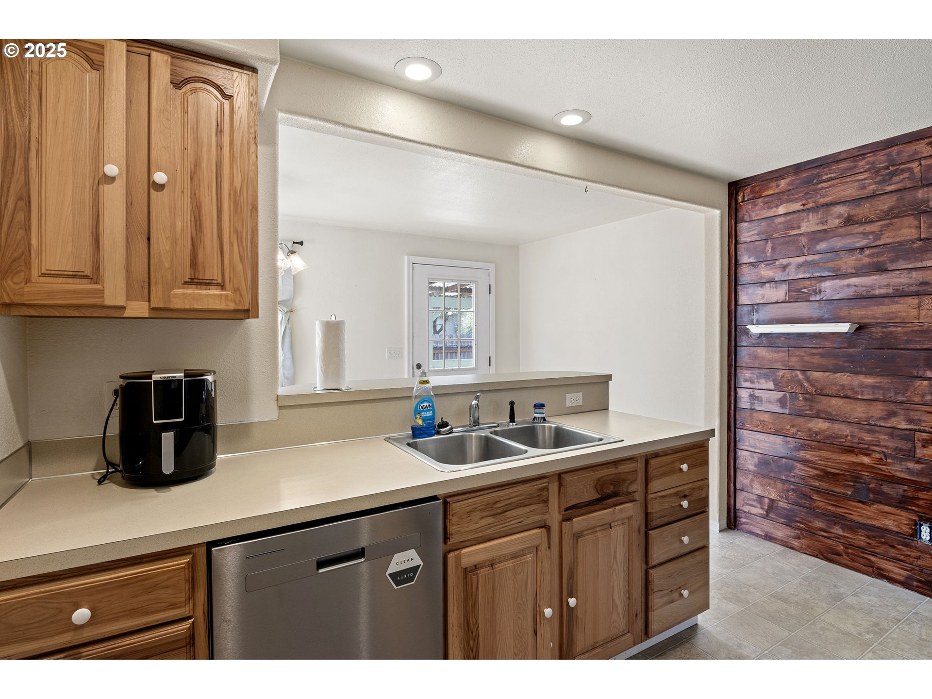 405 Lane Avenue Drain, OR 97435 - Photo 24 of 47 a kitchen with a sink and cabinets