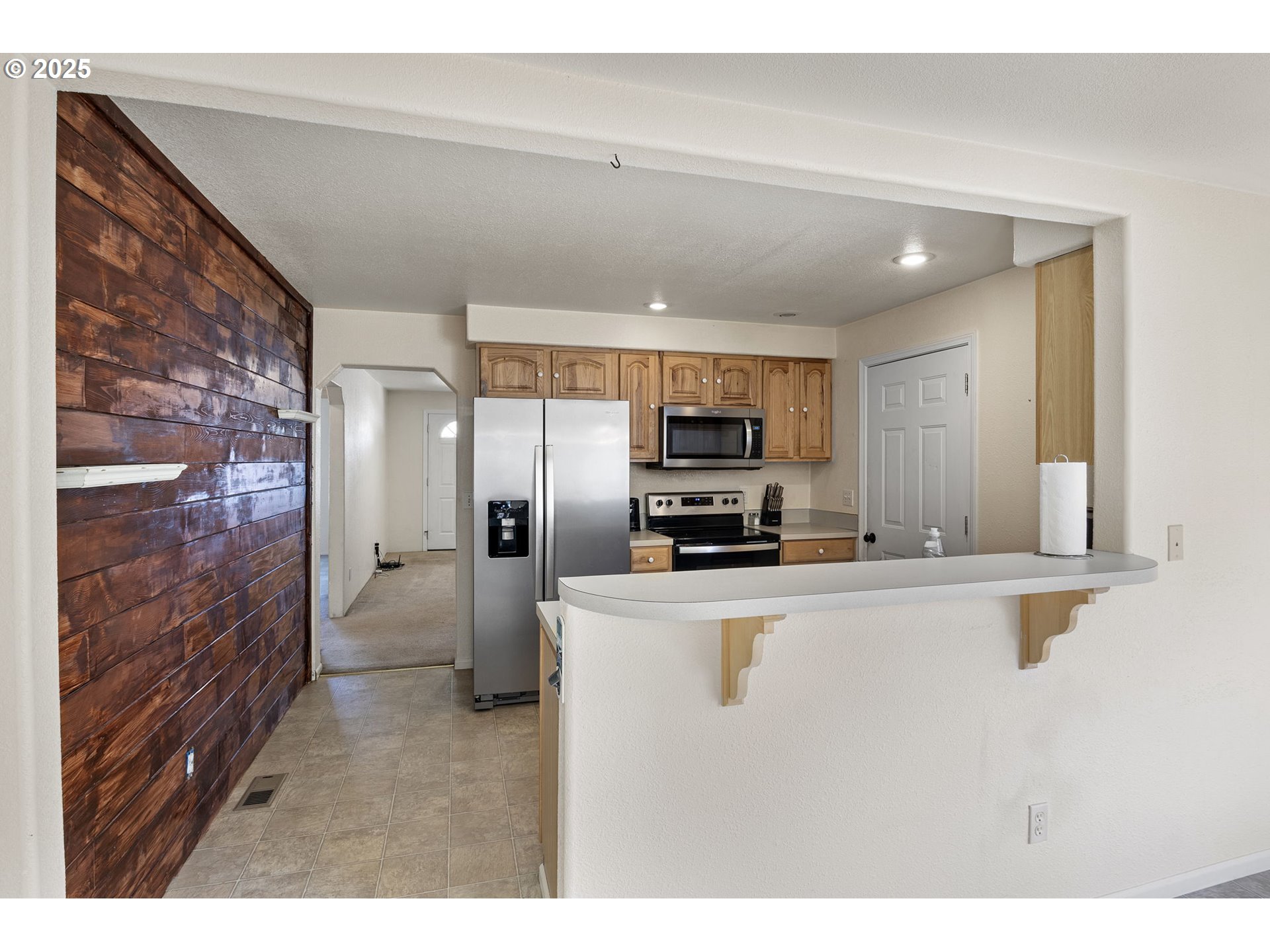 405 Lane Avenue Drain, OR 97435 - Photo 26 of 47 a kitchen with stainless steel appliances a refrigerator and a stove