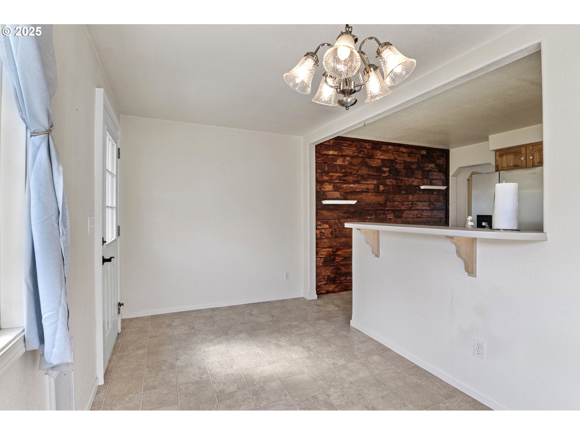 405 Lane Avenue Drain, OR 97435 - Photo 28 of 47 a view of a hallway with a chandelier
