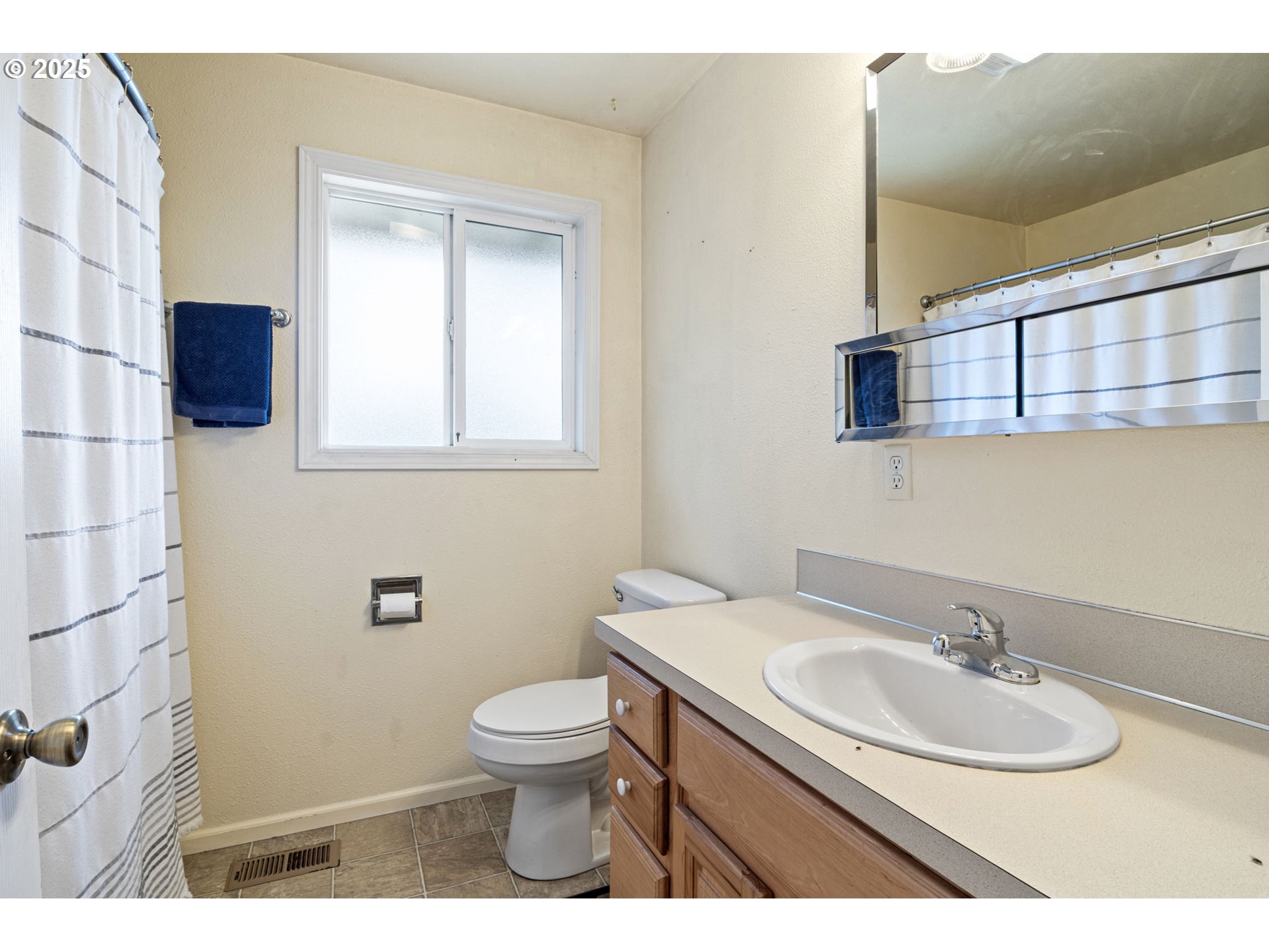 405 Lane Avenue Drain, OR 97435 - Photo 36 of 47 a bathroom with a sink a toilet and mirror