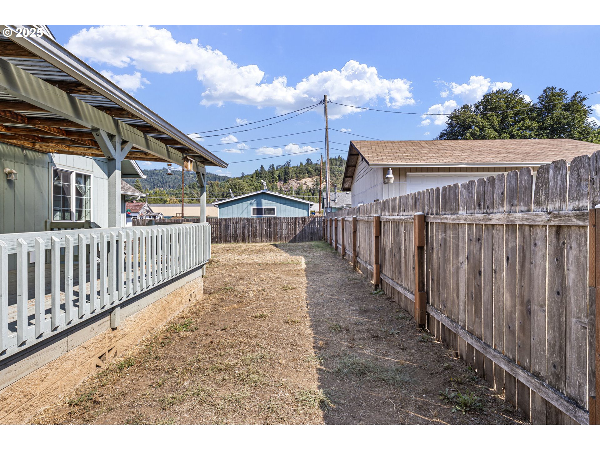405 Lane Avenue Drain, OR 97435 - Photo 44 of 47 a view of a house with backyard and porch